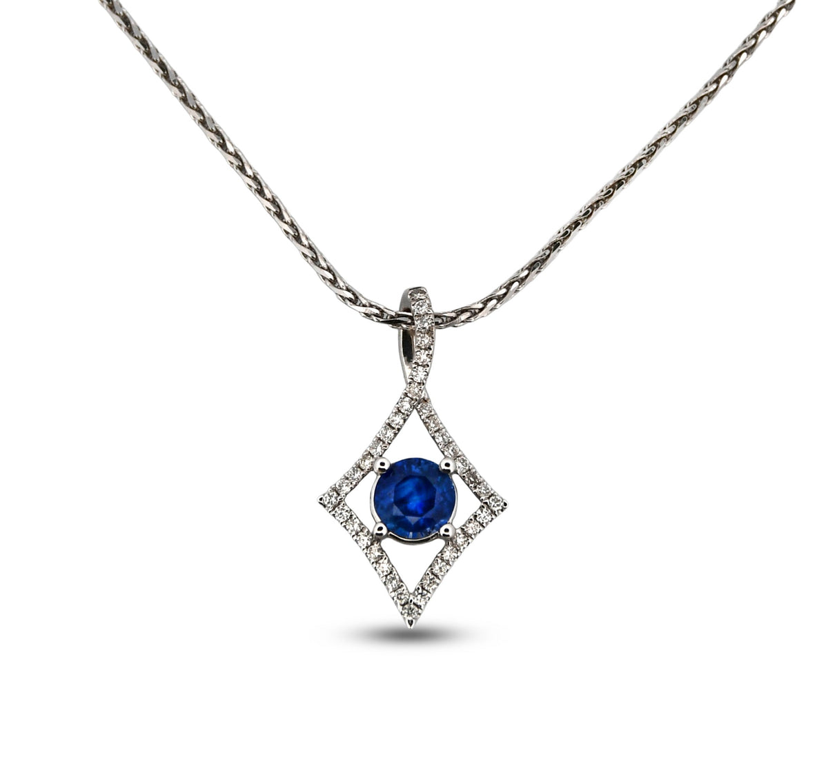 Diamond necklace with a blue gemstone on a white background