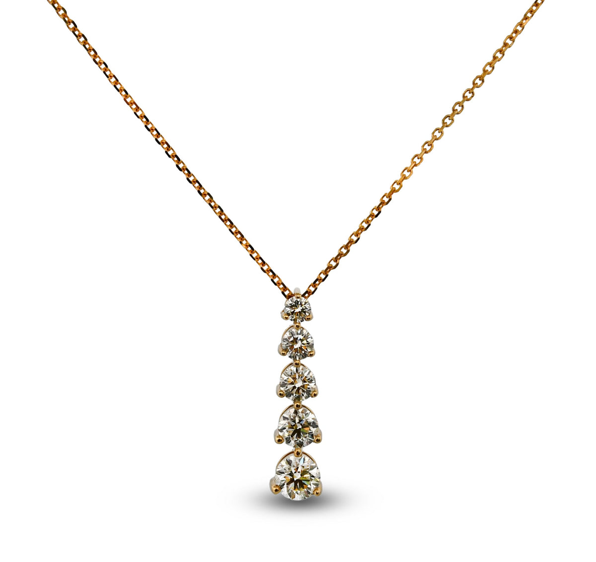 Gold necklace with a diamond pendant on a white background