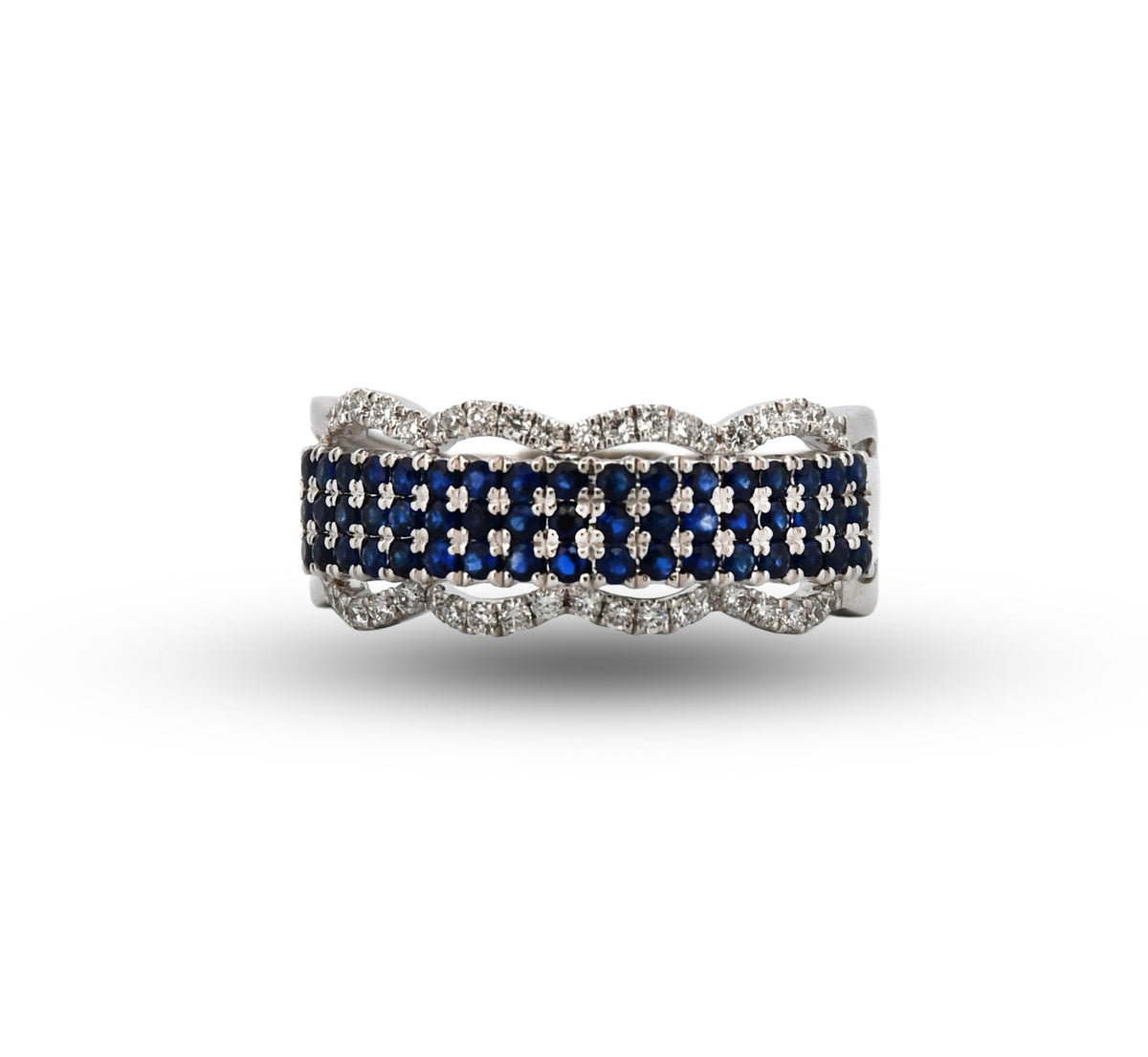 Ring with blue gemstones and white accents on a white background