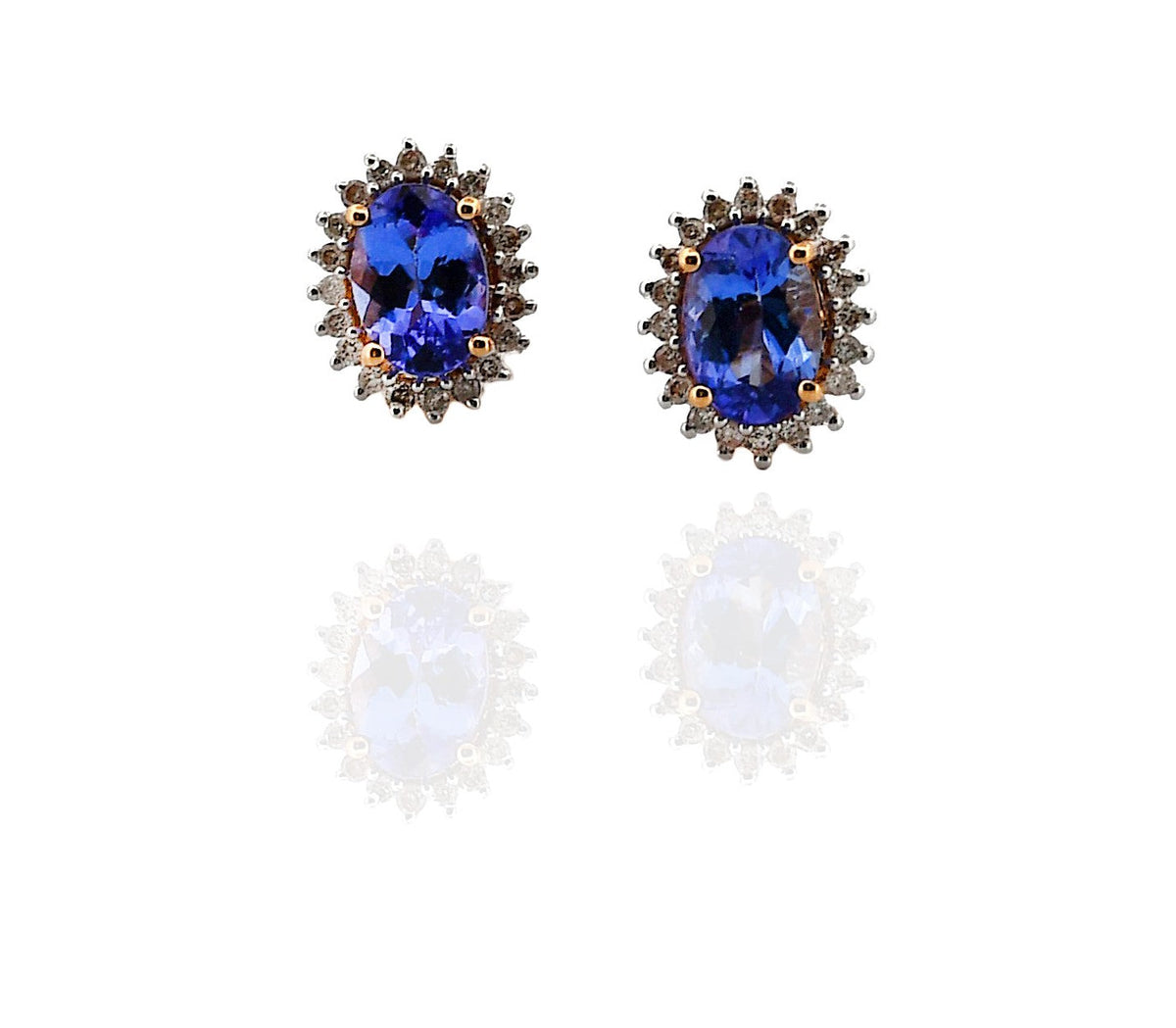 Pair of earrings with blue gemstones on a white background