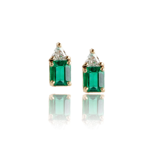 Pair of emerald green earrings with gold accents on a white background