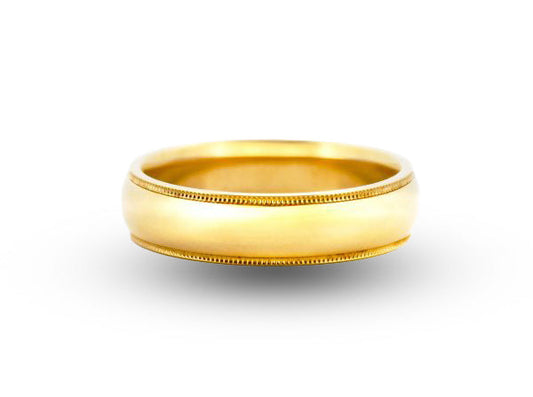 Gold ring on a white background