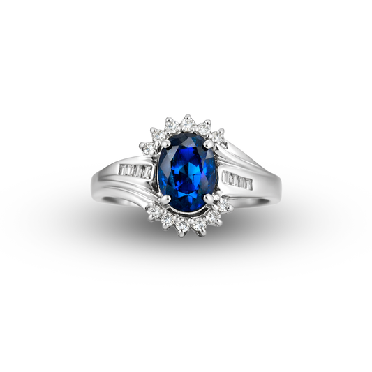 Silver ring with a blue gemstone and diamond accents on a white background