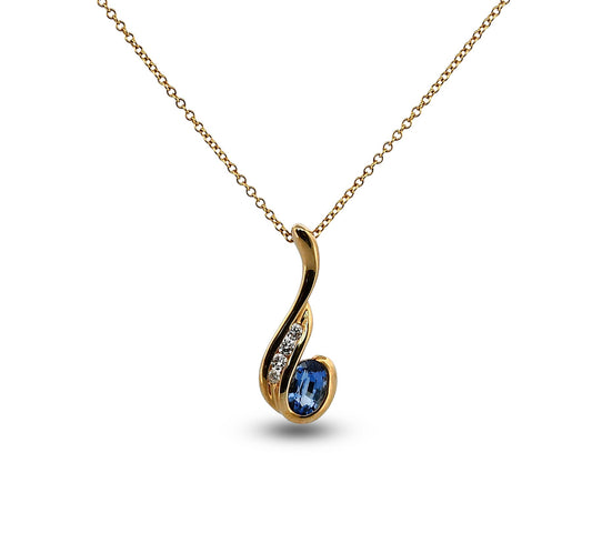 Gold necklace with a blue gemstone pendant on a white background