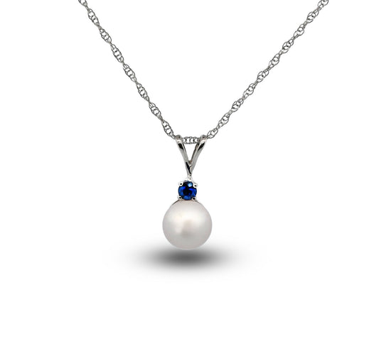 Pearl necklace with a blue gemstone on a white background