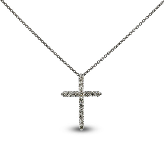 Silver cross necklace on a white background