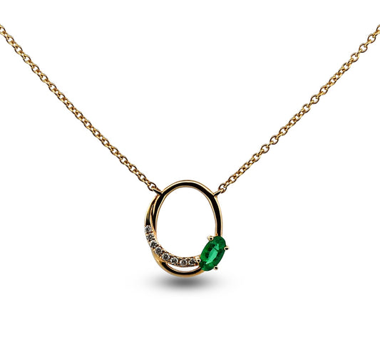 Gold necklace with a green gemstone pendant on a white background