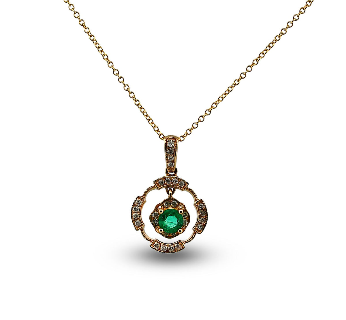 Gold necklace with a green gemstone pendant on a white background