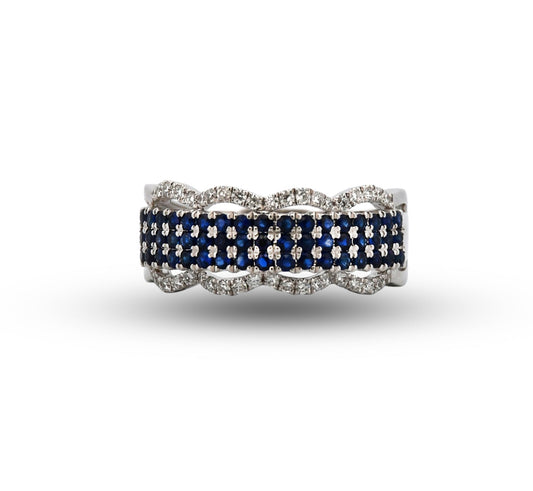 Ring with blue gemstones and white accents on a white background