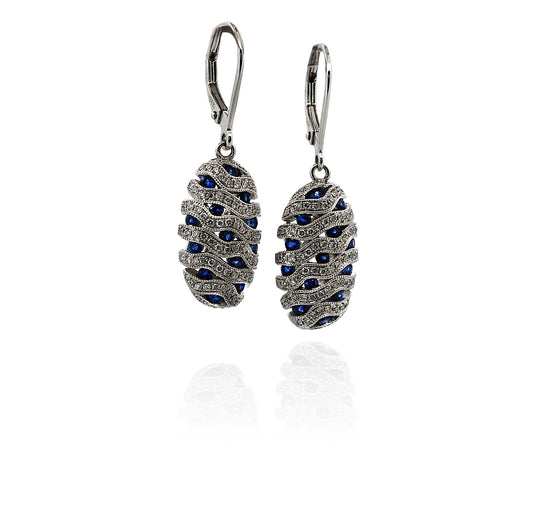 Pair of silver earrings with blue gemstones on a white background