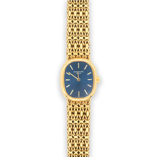 Gold watch with blue face on a white background