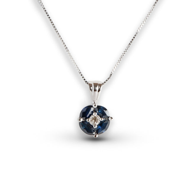 Silver necklace with a blue gemstone pendant on a white background