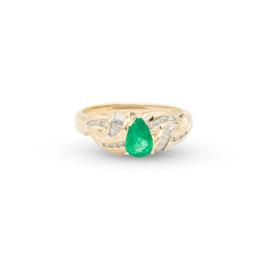 Gold ring with three red stones on a white background