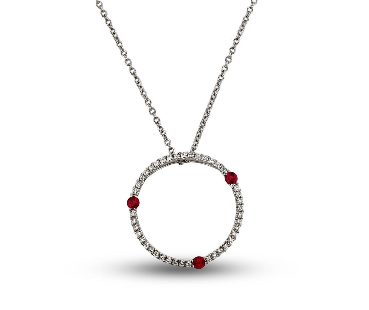 Necklace with a circular pendant featuring red stones on a white background