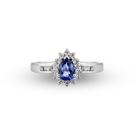 Diamond ring with a blue gemstone on a white background