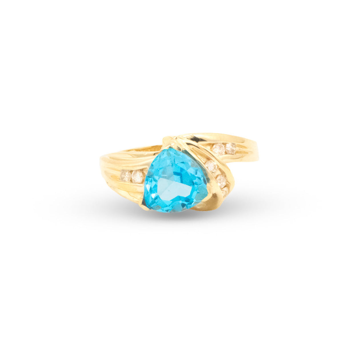 Gold ring with a blue gemstone on a white background