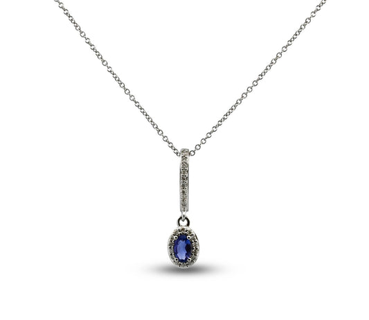 Silver necklace with a blue gemstone pendant on a white background